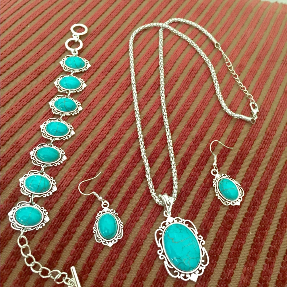 Silver hardware. Green stones.